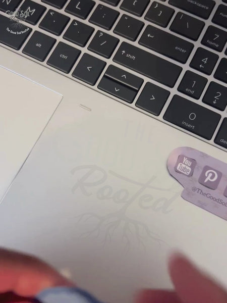 Video clip of blue colored sticker with the text Be Sober Be Vigilant  being placed on a laptop